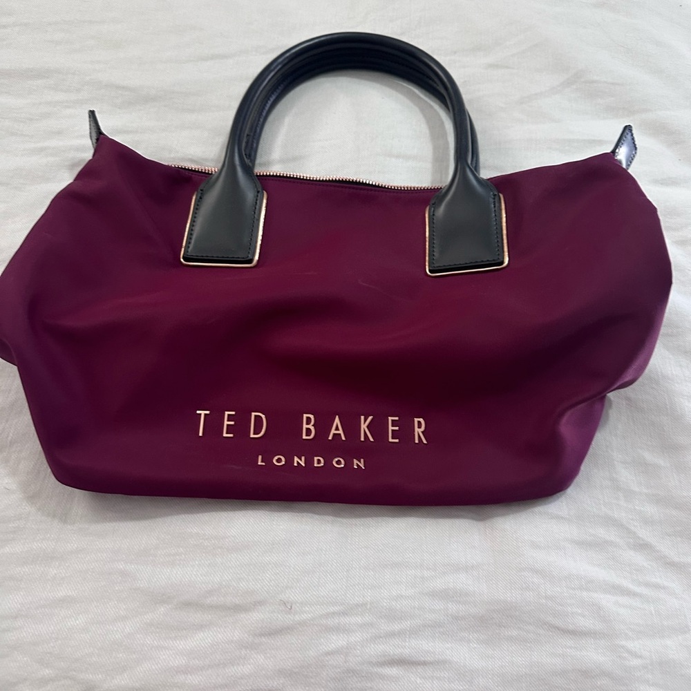 TED BAKER- longchamp-like - burgundy w/raised gold letters & studded bottom